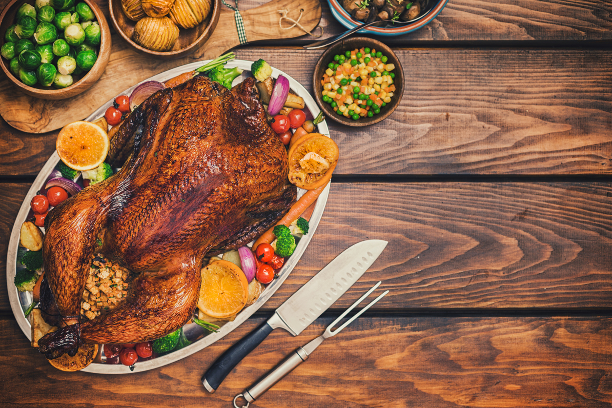 Traditional Stuffed Turkey Dinner with Side Dishes for Thanksgiving Celebration