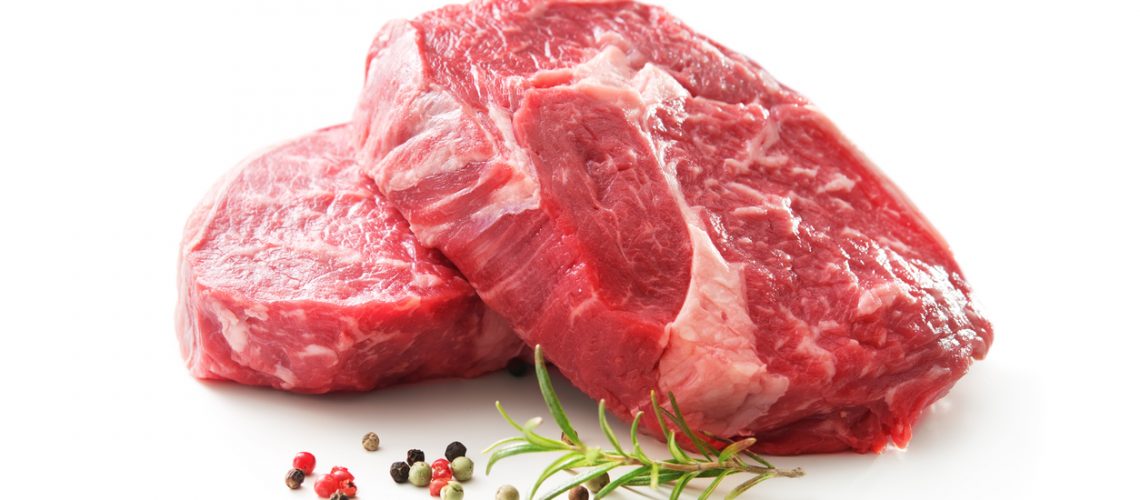 fresh raw rib eye steaks isolated on white